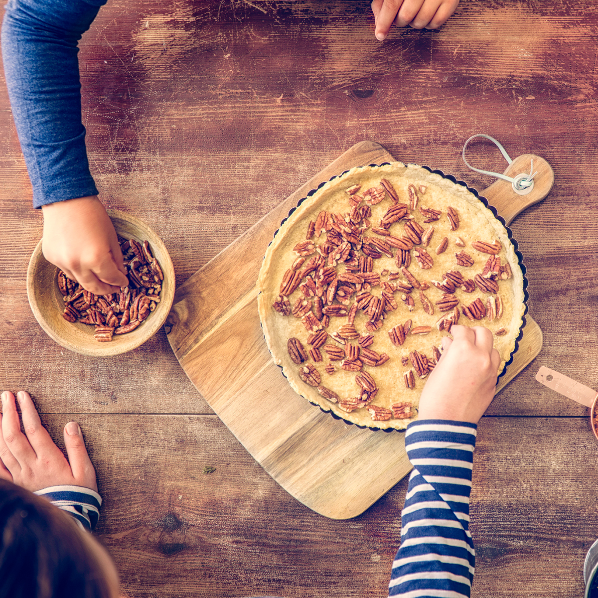 Family Making Pecan Pie