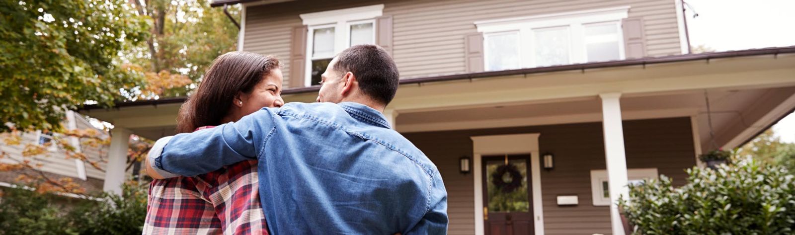 Couple walking up to their home