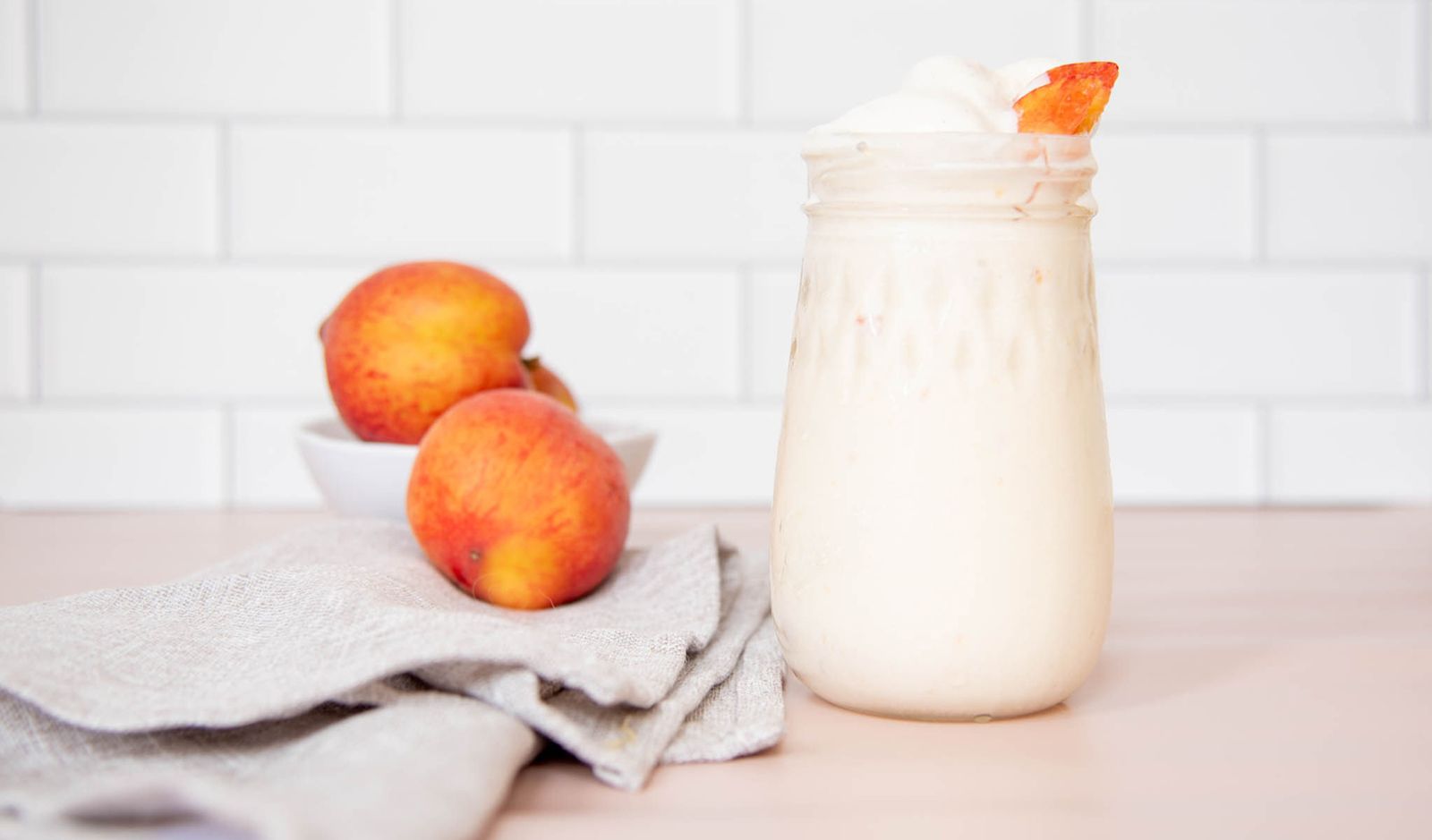 peach ice cream in mason jar